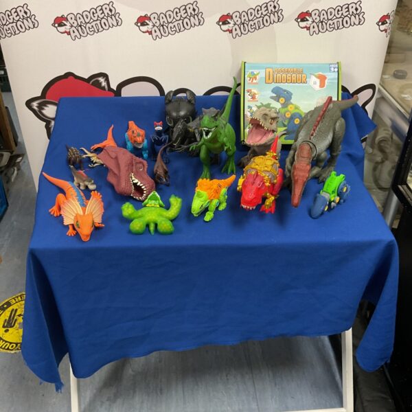 Colourful dinosaur toy lot including Jurassic Park figures.