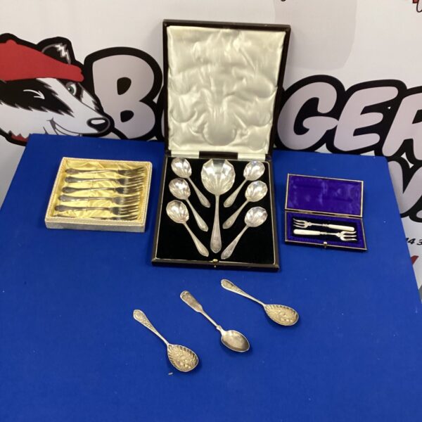 Vintage silverplate cutlery set in original boxes, antique flatware.