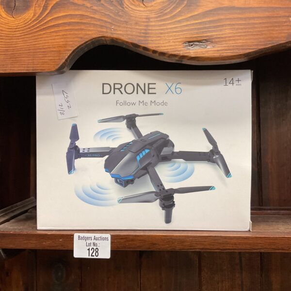 Black and grey Drone X6 quadcopter with propellers.