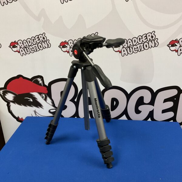 Silver Manfrotto tripod for camera photography equipment.