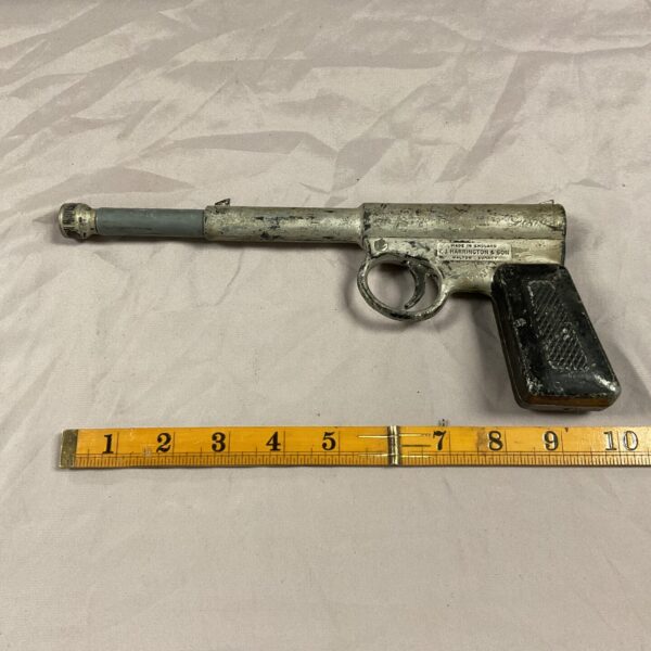Antique Harrington Gat Gun, vintage cast iron toy pistol.