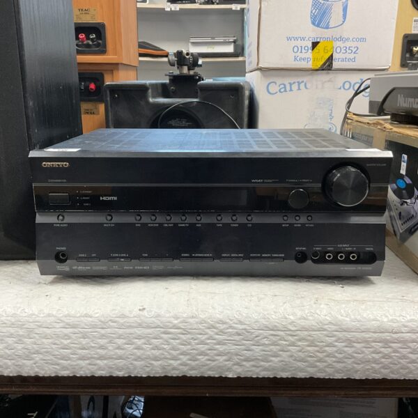Black Onkyo TX-SR605 AV receiver for home cinema setup.