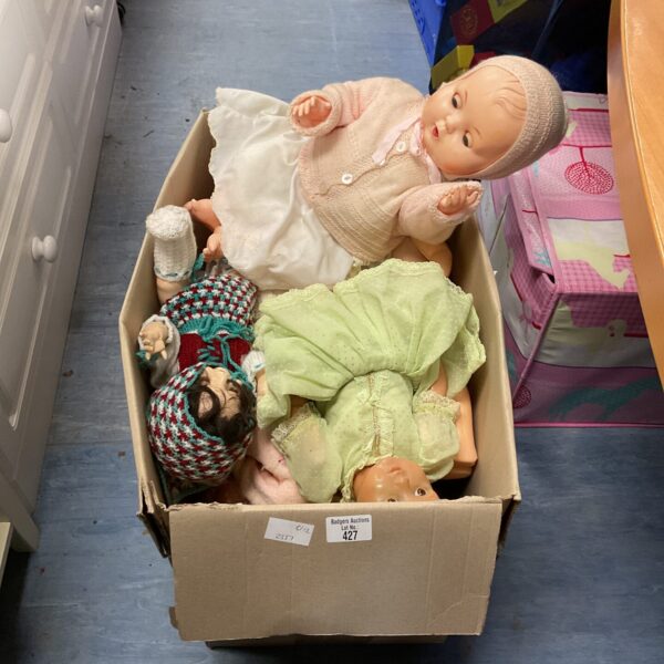 Vintage childrens dolls in a box, antique toy collection.