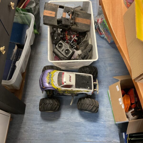 Vintage RC Megaforce car with mixed RC items in a lot.