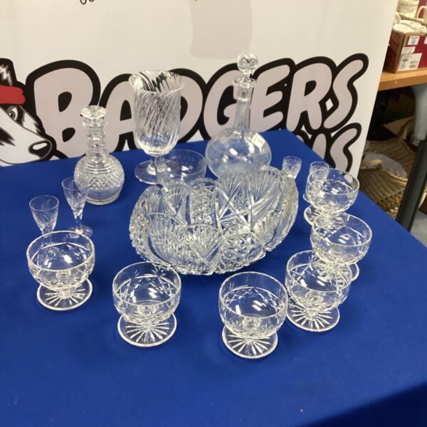 Vintage crystal fruit bowls and glasses on display, elegant glassware.