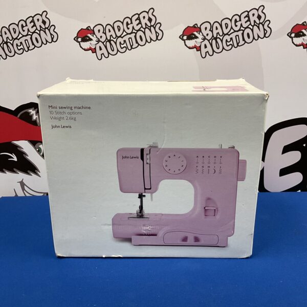 Pink John Lewis mini sewing machine for small projects and repairs.