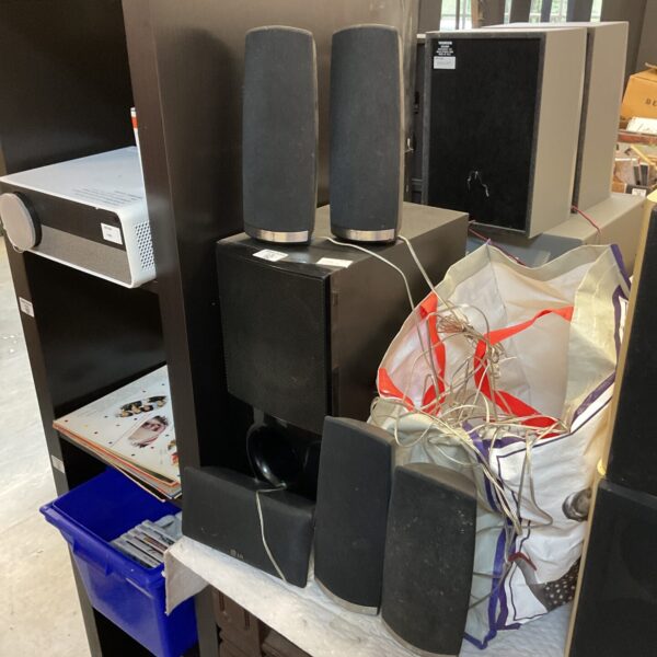 LG surround sound system with five satellite speakers in a lot.
