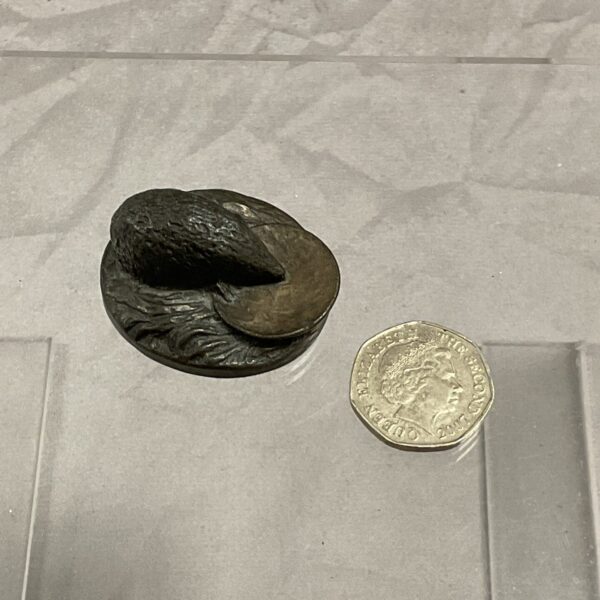 Detailed bronze hedgehog sculpture, vintage animal figurine.