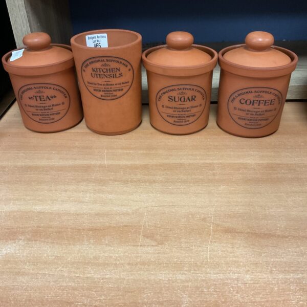 Vintage terracotta storage jars for sugar, coffee, tea and utensils.