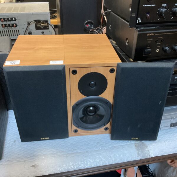 Vintage Teac LS-300U bookshelf speakers in wooden cabinets.