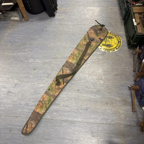Camouflage Jack Pyke gun slip for secure firearm transport.