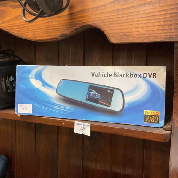 Black vehicle dash camera for recording driving footage.