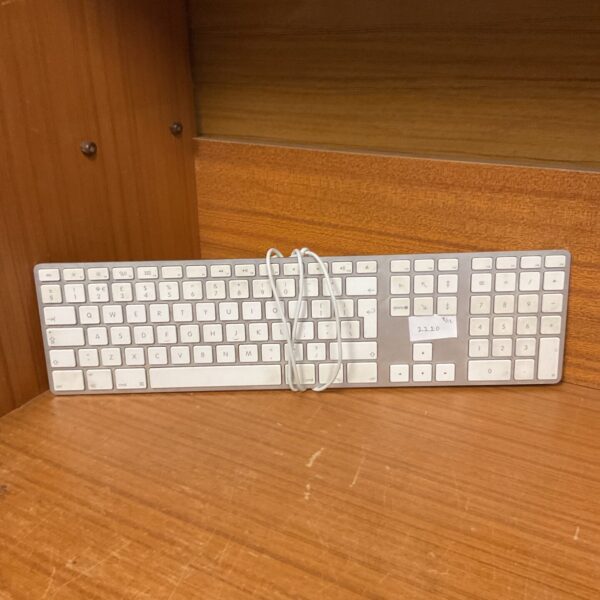 Vintage Apple keyboard with wired connection for retro computers.