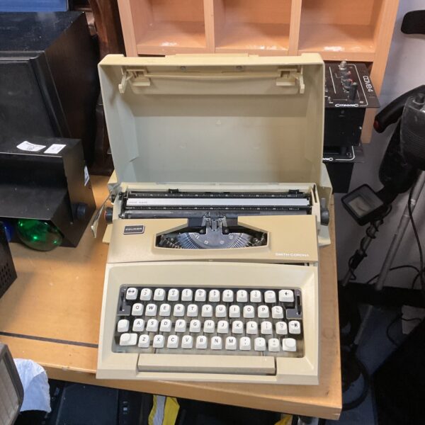 Vintage Smith Corona Courier typewriter in black.