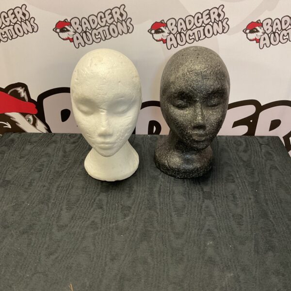 Polystyrene mannequin head for wig display and styling.