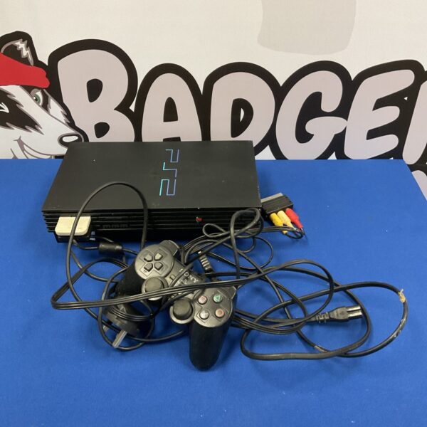 Black Sony PlayStation 2 console with controller and cables.