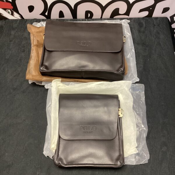 Pair of new leather Polo Videng man bags on display.
