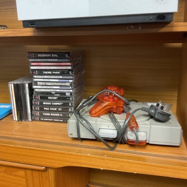 Sony PlayStation 1 console with games, retro gaming system.