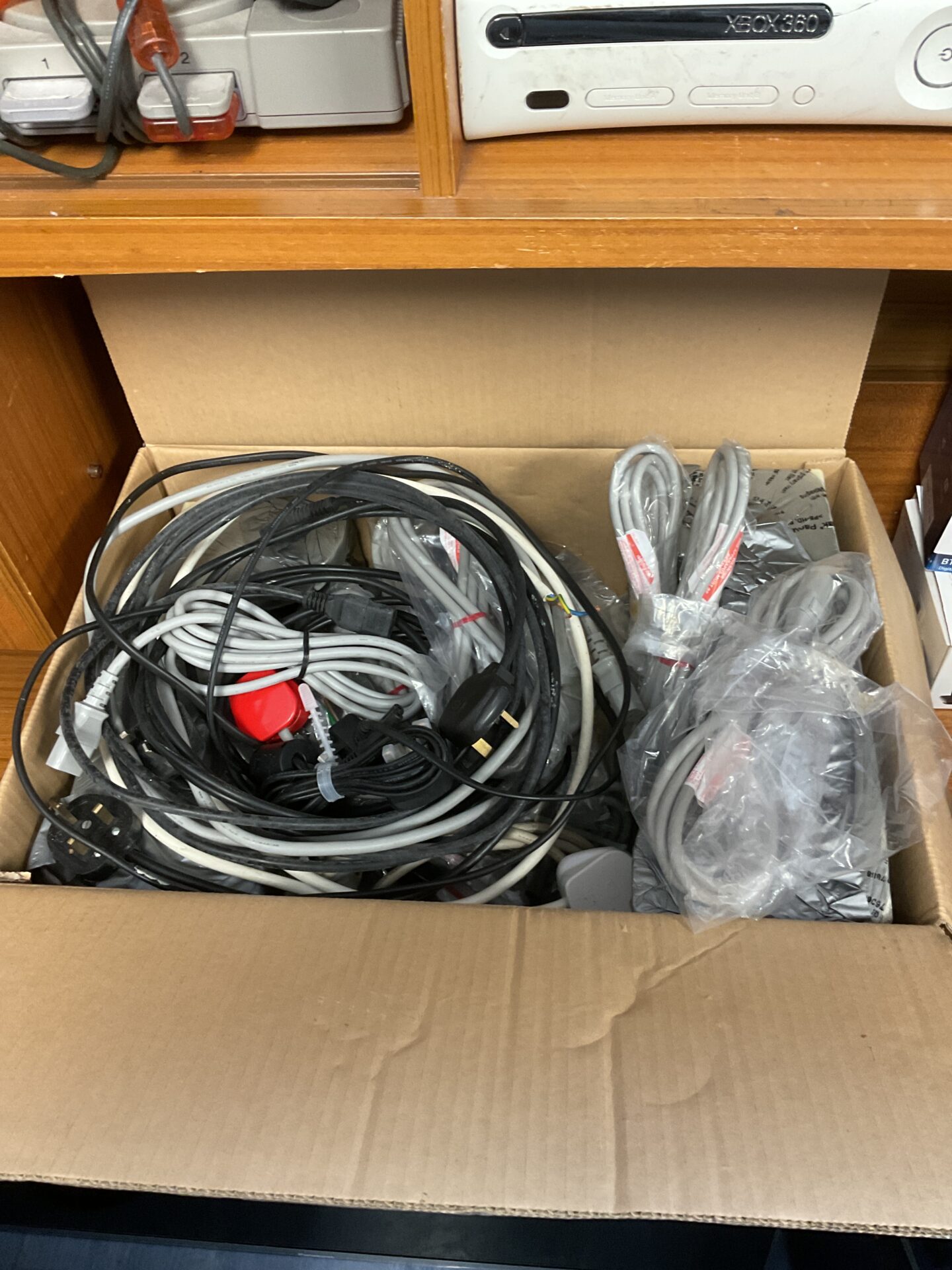 217 Large box of mixed cables including new kettle leads
