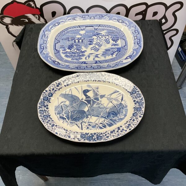 Vintage blue and white porcelain serving dishes with Chinese landscape scenes.