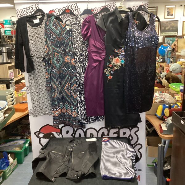 Ladies evening dresses, leather jacket and new sweatshirt in a fashion lot.