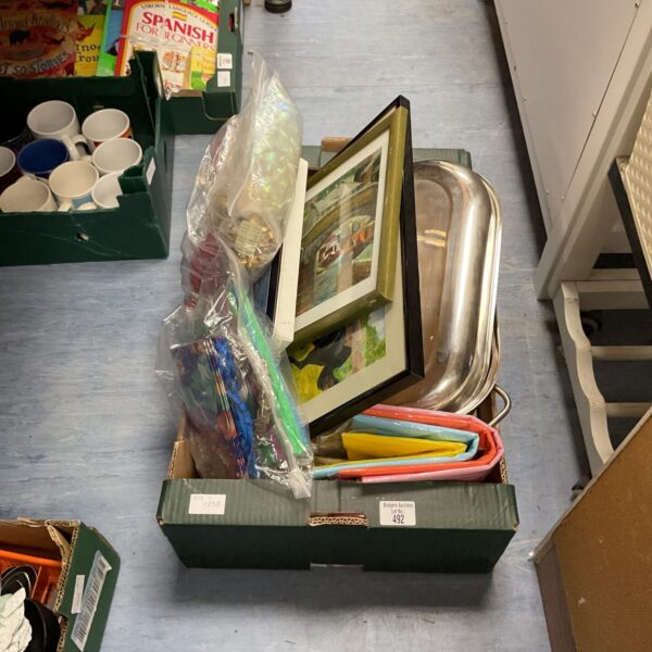 Mixed lot box with artwork, Christmas decorations, and a breadbin visible.