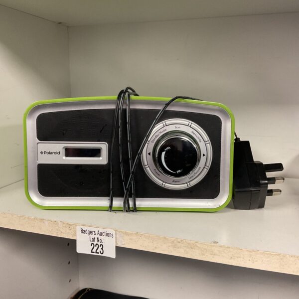 Vintage Polaroid green DAB radio for digital audio broadcasts.