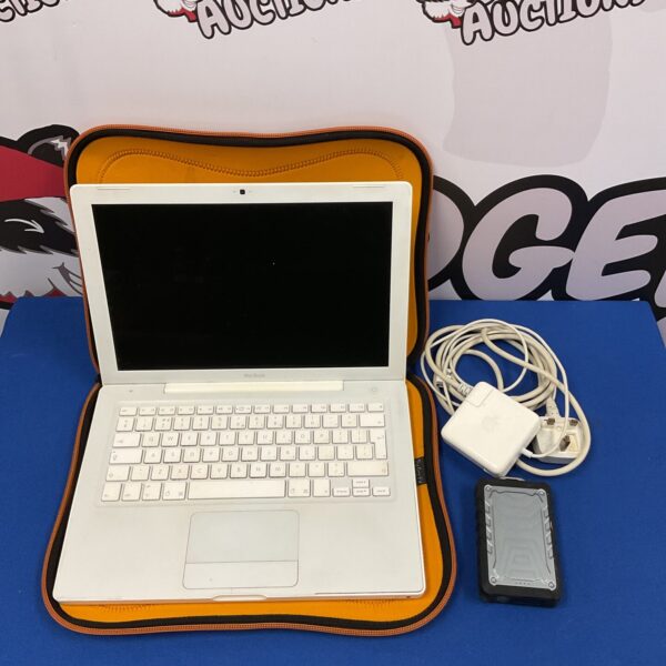 Silver Apple Macbook laptop with charger included.