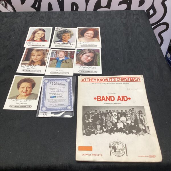 Coronation Street actor autographs with Band Aid sheet music booklet.