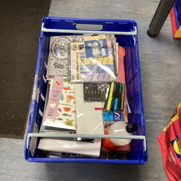 Mixed craft supply lot with paper, pens, and art materials.