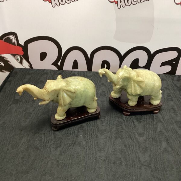 Pair of vintage marble elephant ornaments for home decor.