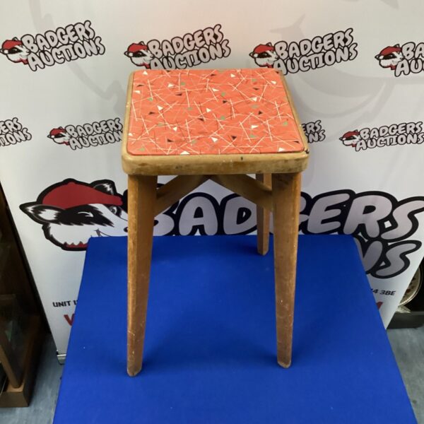 Vintage Formica kitchen stool with a retro design.