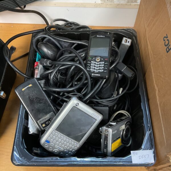 Mixed lot of vintage mobile phones, cameras and cables.