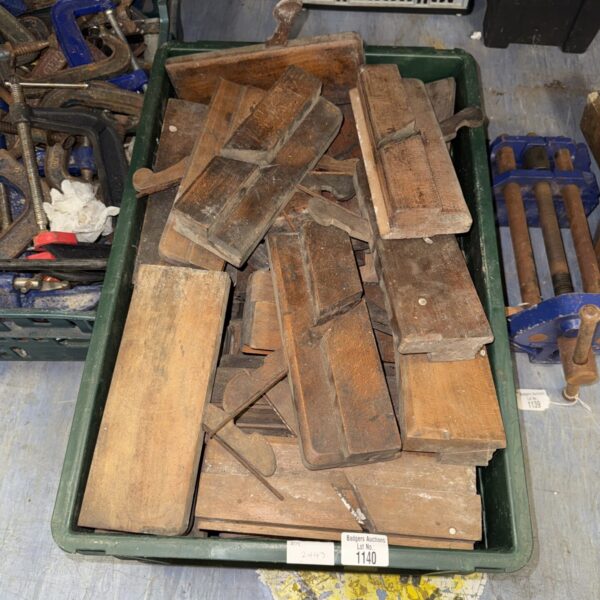 Vintage woodworking tools lot with antique hand planes.