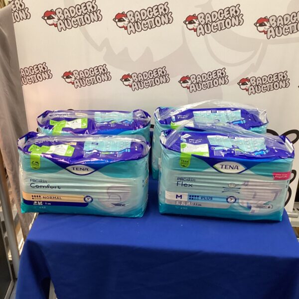 Four packs of Tena M Plus Flexi Pants for incontinence.