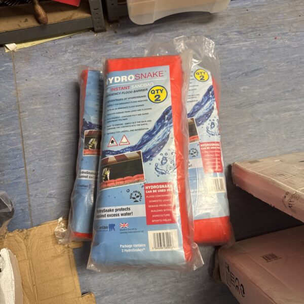 Three sealed bags of Hydro Snake flood protectors for emergency defence.