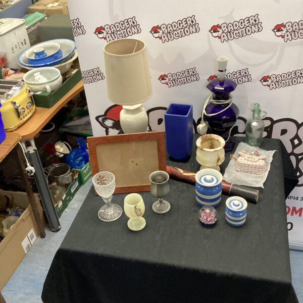Mixed lot of vintage table lamps and collectibles for home decor.