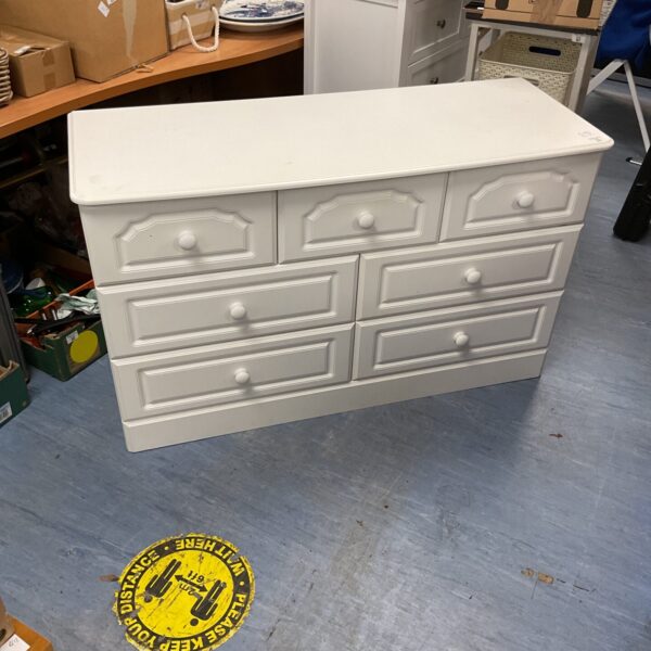 White Kingstown chest of drawers with three over four drawer configuration.