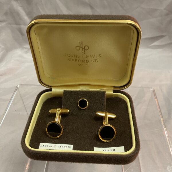 Vintage John Lewis onyx cufflinks and tie pin set displayed in box.