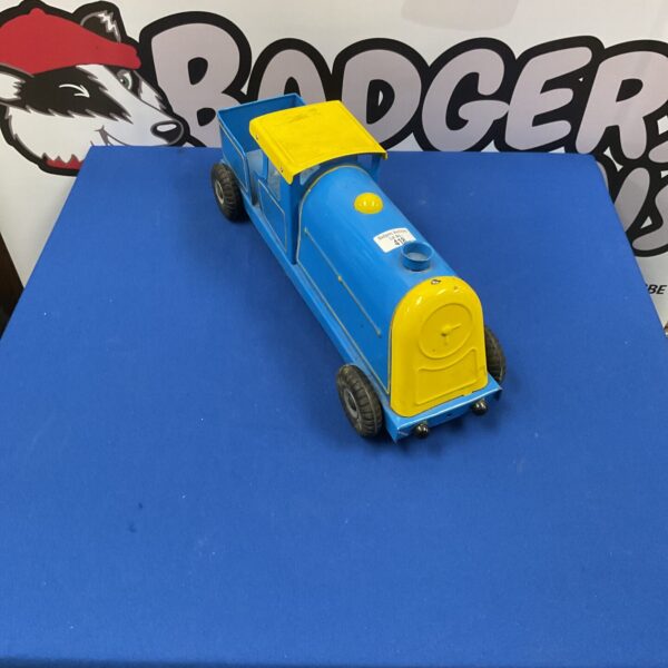 Vintage Triang train in blue and yellow, collectible model railway.