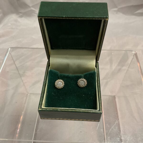 Sparkling silver cubic zirconia stud earrings on display.