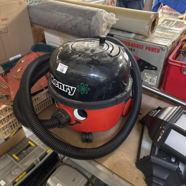 Red Numatic Henry Hoover with extension pole, used condition.