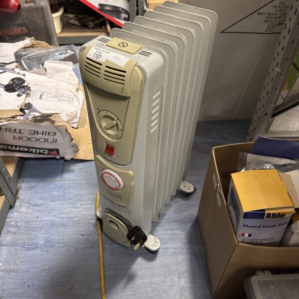 White oil filled radiator model 1101 for home heating.