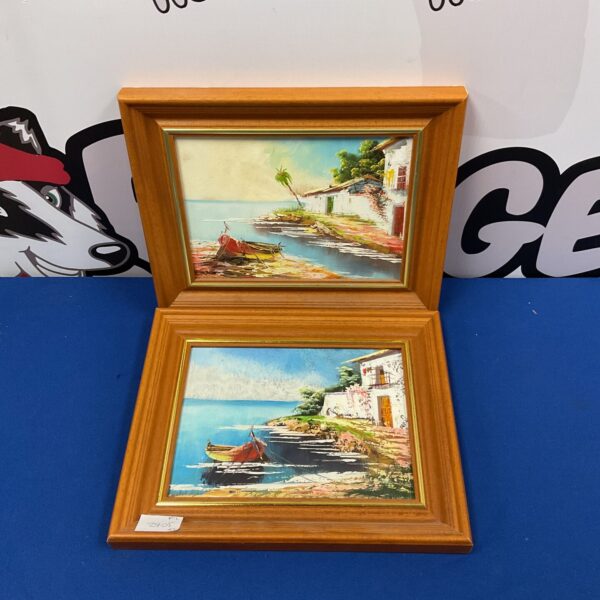 Pair of vintage Mediterranean coastal oil paintings in gold frames.