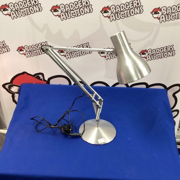 Brushed steel Anglepoise style desk lamp for task lighting.