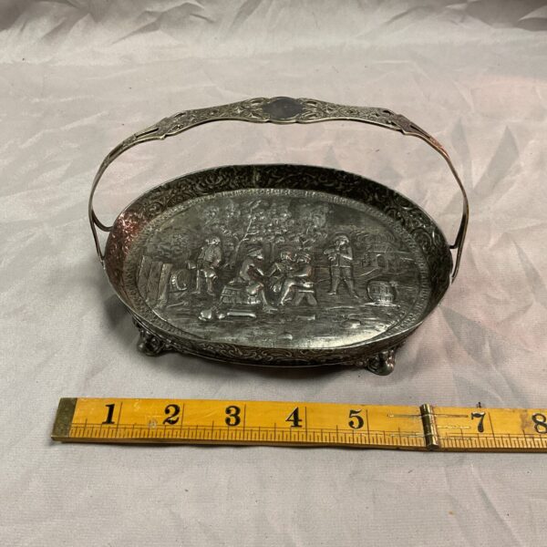Antique silverplate tray with detailed repousse oval scene and handle.