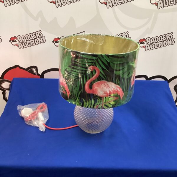 Vintage flamingo table lamp with glass shade and vibrant pattern.