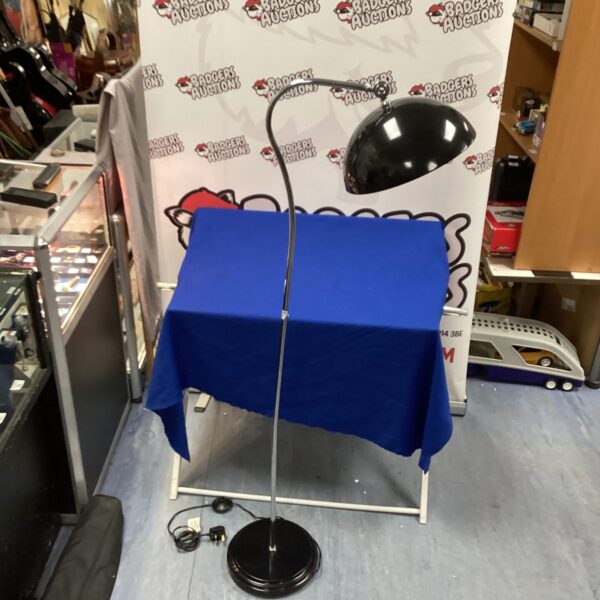 Vintage chrome and black standard lamp with adjustable shade.