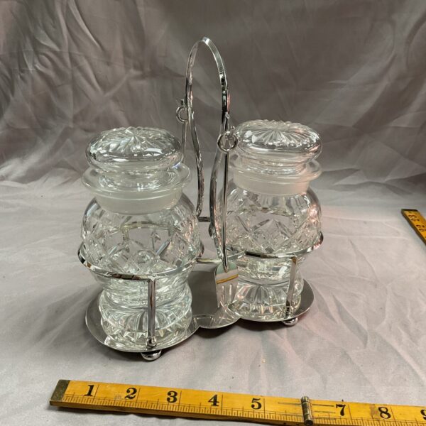 Vintage silverplate and crystal chutney set with embossed floral details.