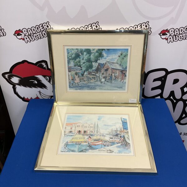 Pair of vibrant Jill Walker Barbados prints depicting Caribbean scenes.